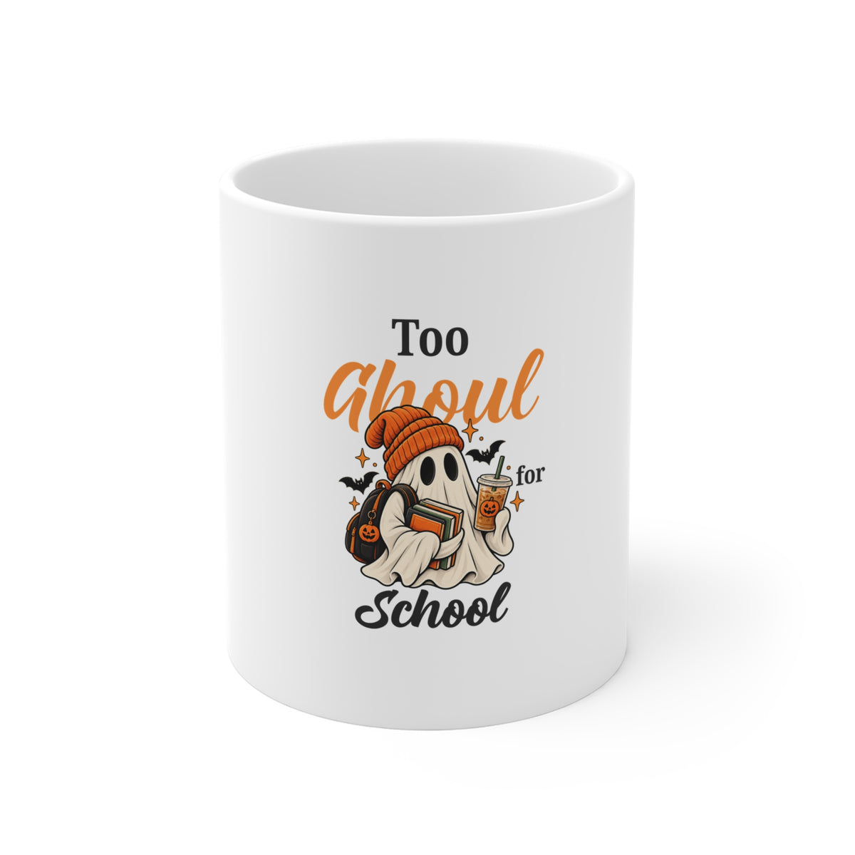 A white ceramic mug featuring the text 'Too Ghoul for School' with a ghost holding books and coffee
