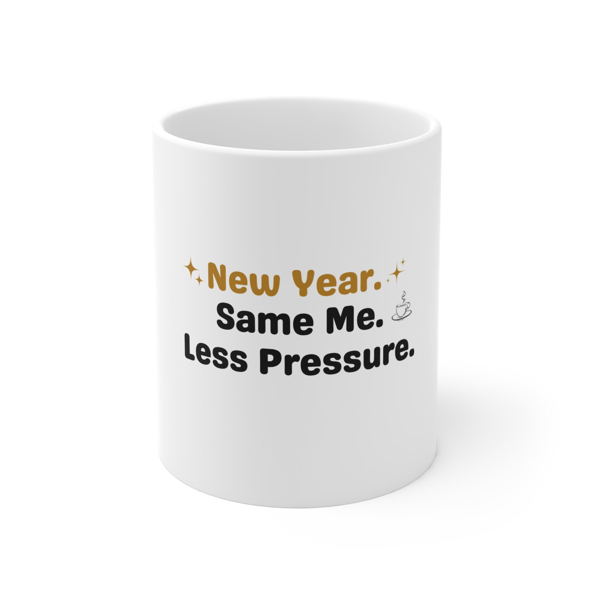 White mug with humorous text 'New Year. Same Me. Less Pressure.' on a white background