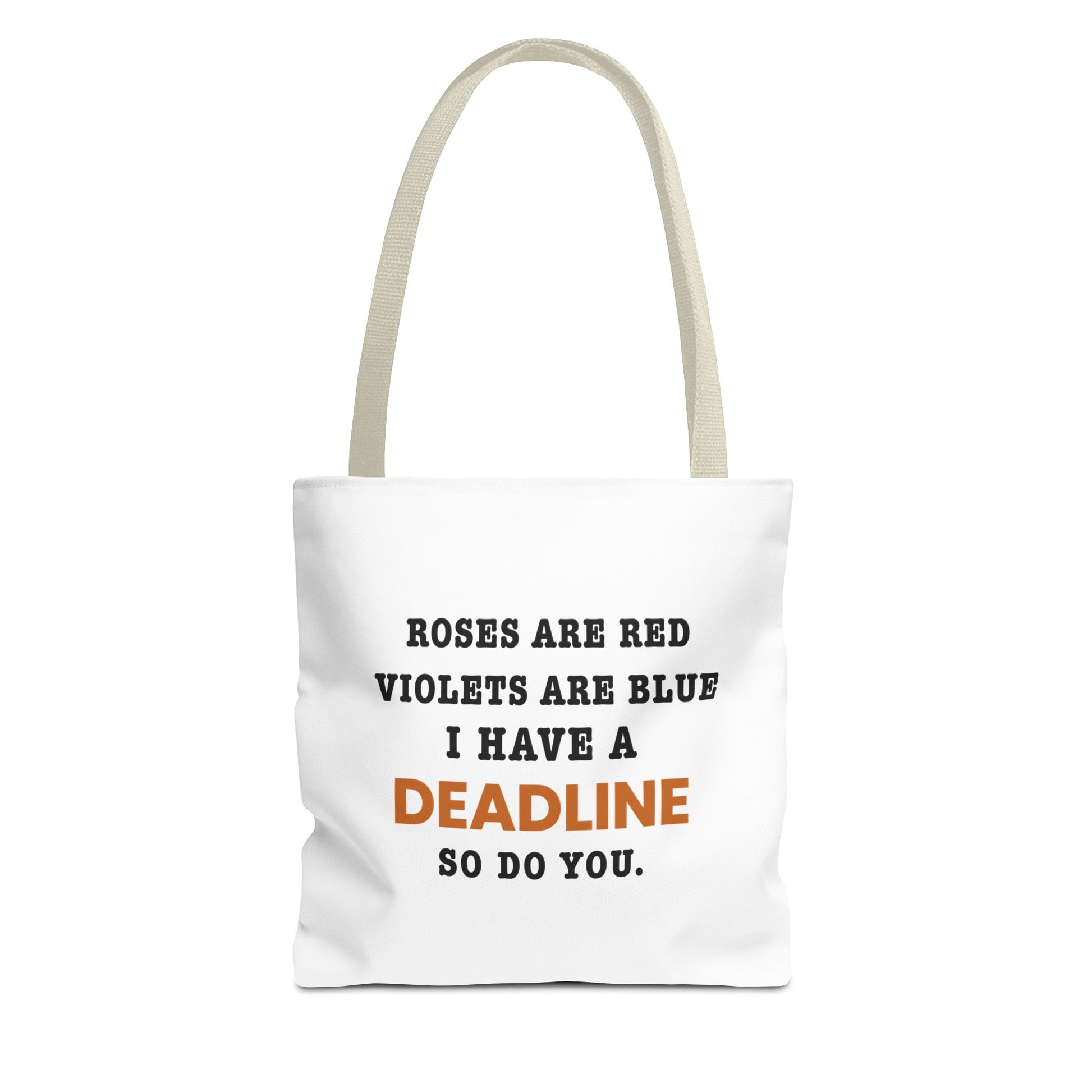 Tote bag with beige handles and text 'Roes are red, violets are blue. I have a deadline so you do' on a white background