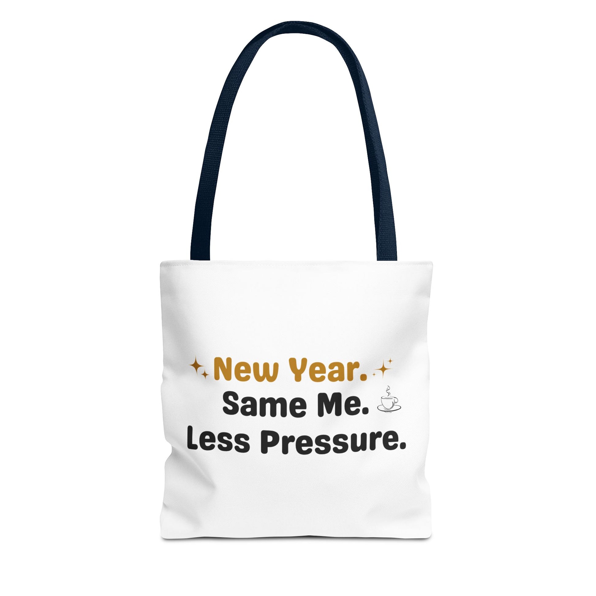 White tote bag with navy handle and text 'New Year. Same Me. Less Pressure.' and handle on a white background