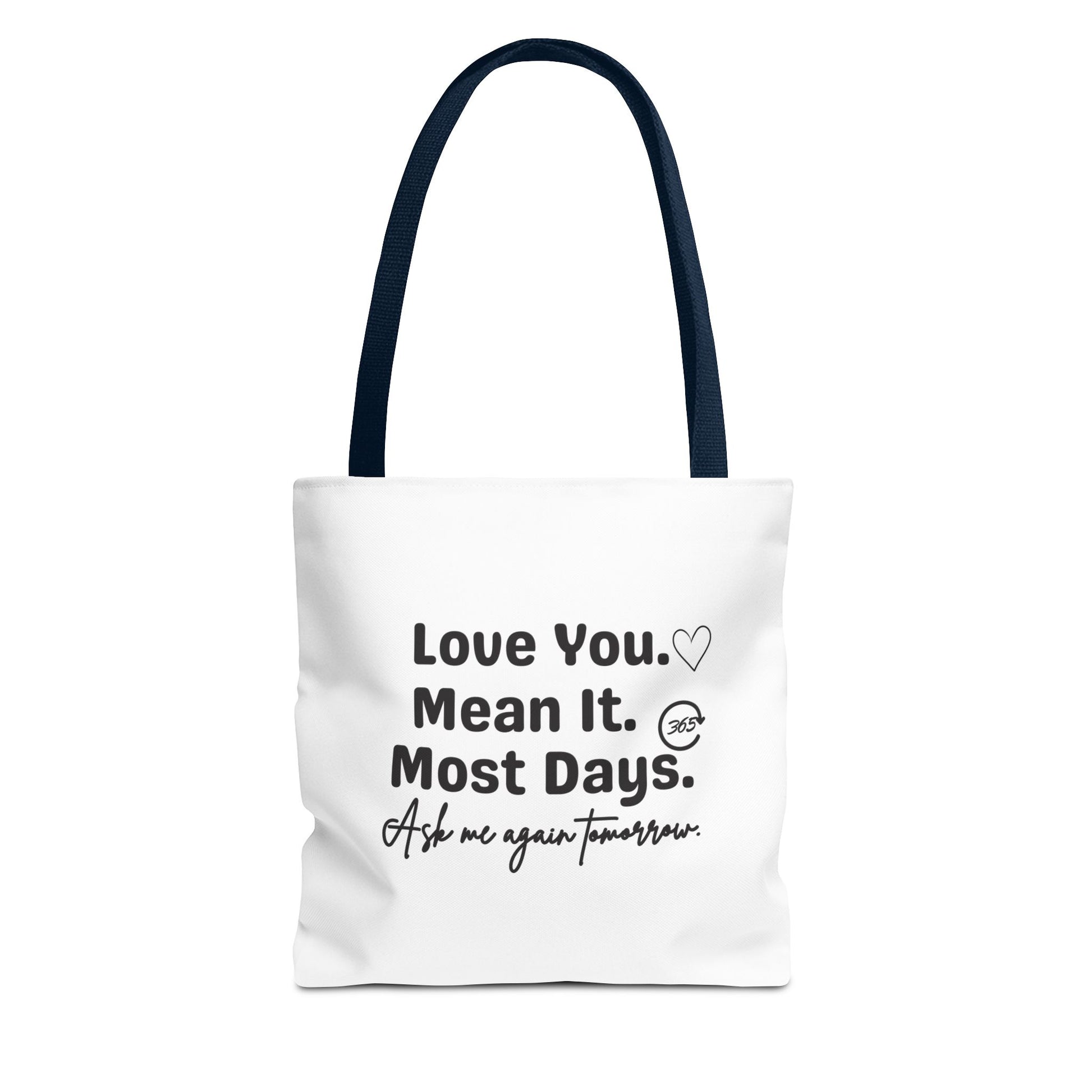 White tote bag with navy handle and text 'Love You. Mean It. Most Days. Ask me again tomorrow.' on a white background