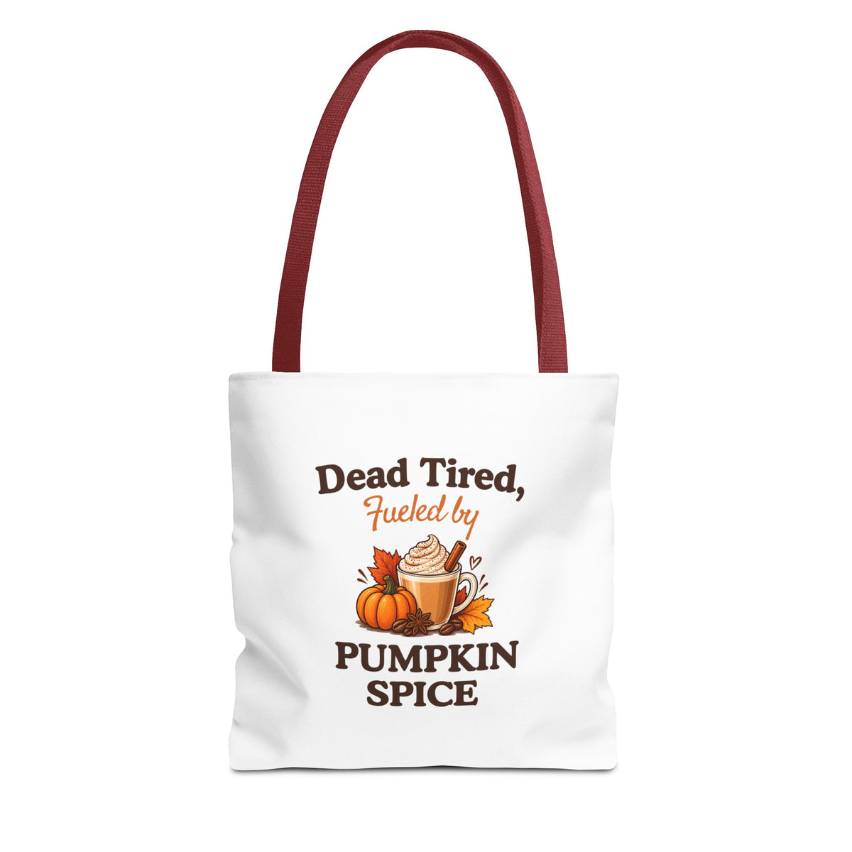 A white canvas tote bag with red shoulder straps, featuring a printed autumn-themed graphic that reads 'Dead Tired, Fueled by Pumpkin Spice'