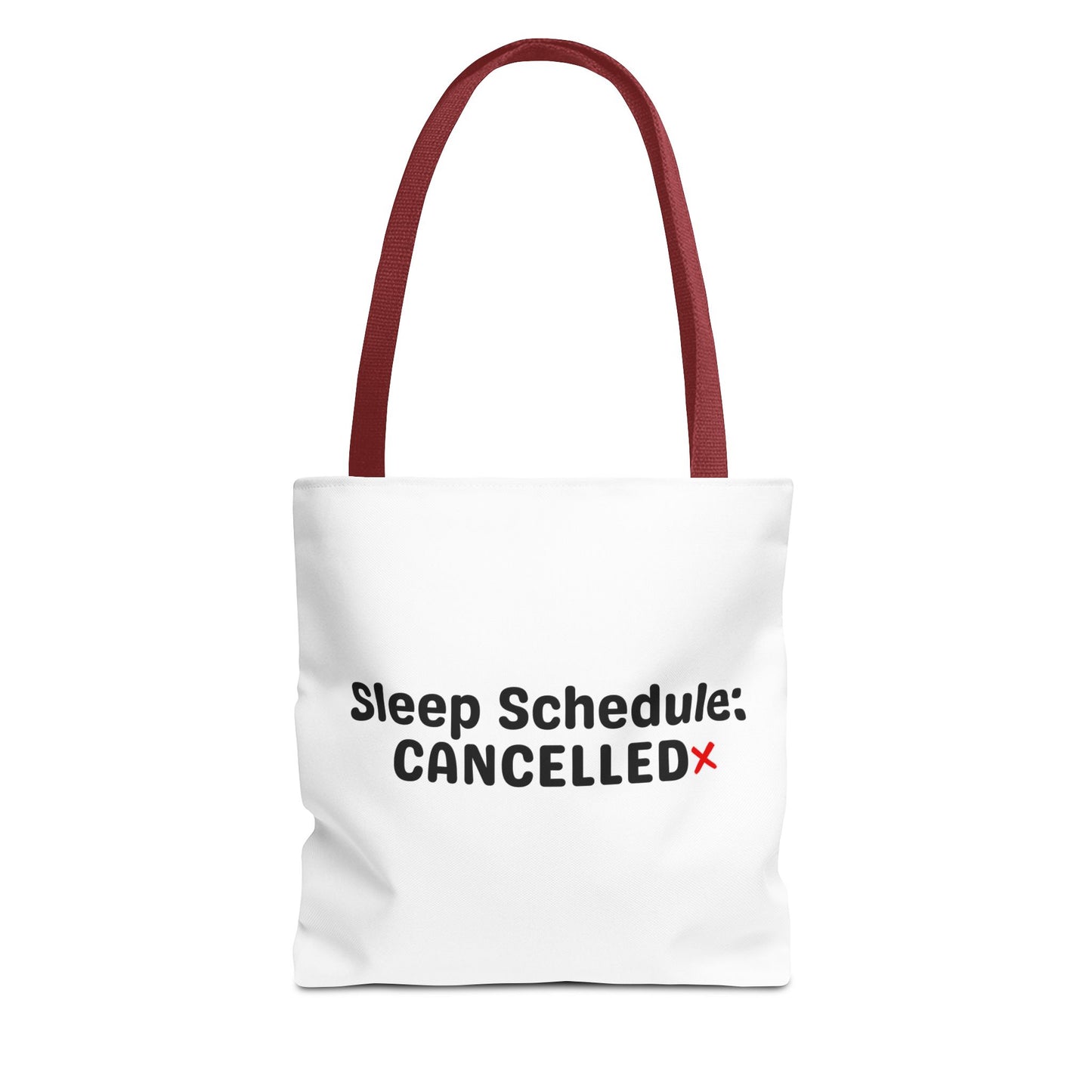 White tote bag with red handle and text 'Sleep Schedule: Cancelled' on a white background
