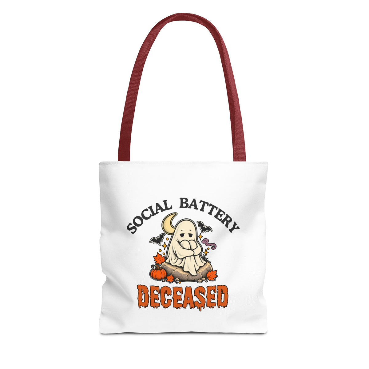 A white tote bag with red handles, featuring a 'Social Battery: Deceased' graphic with a ghost sitting on a rock