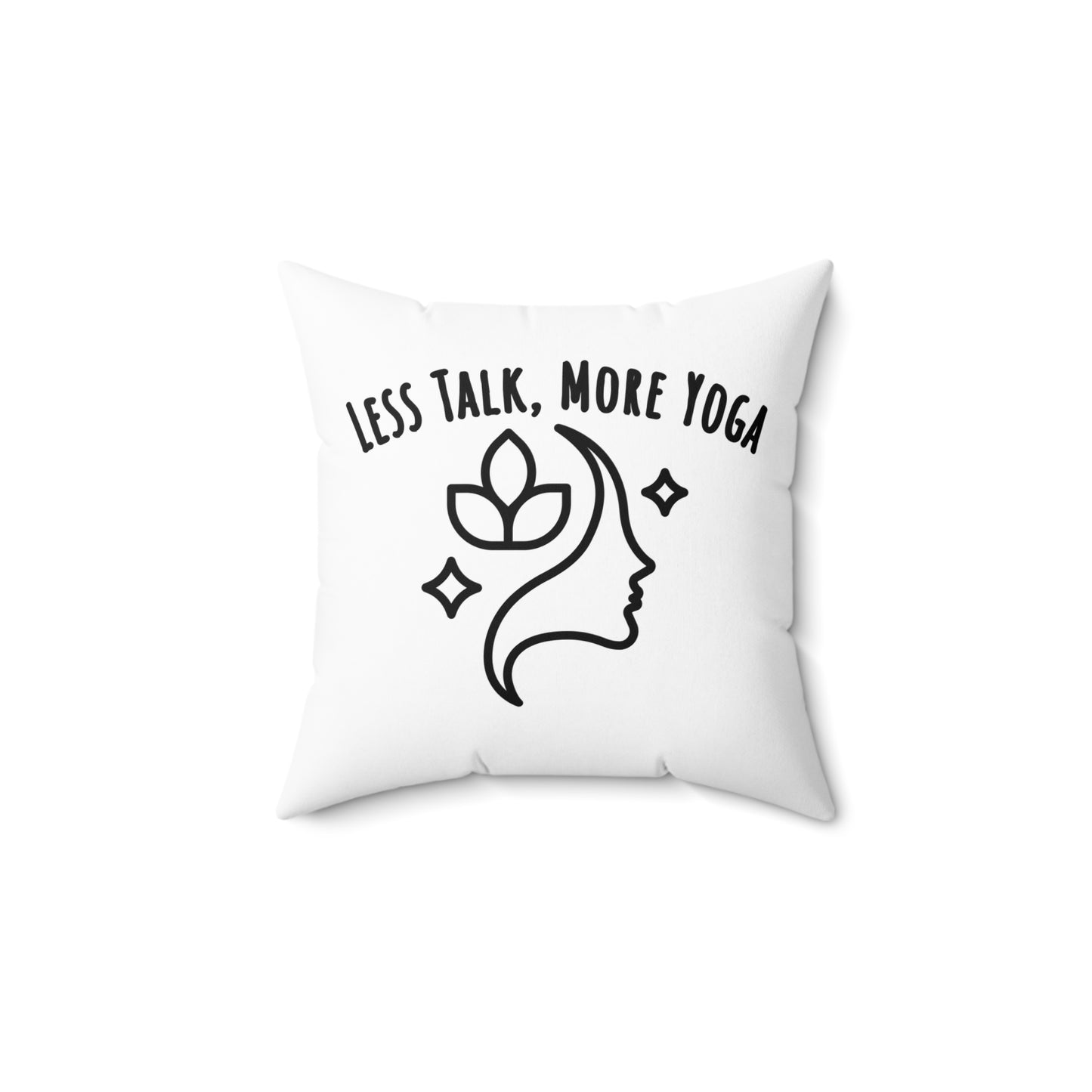 White pillow with black text 'LESS TALK, MORE YOGA' and a design of a face with a lotus flower on a white background - backside