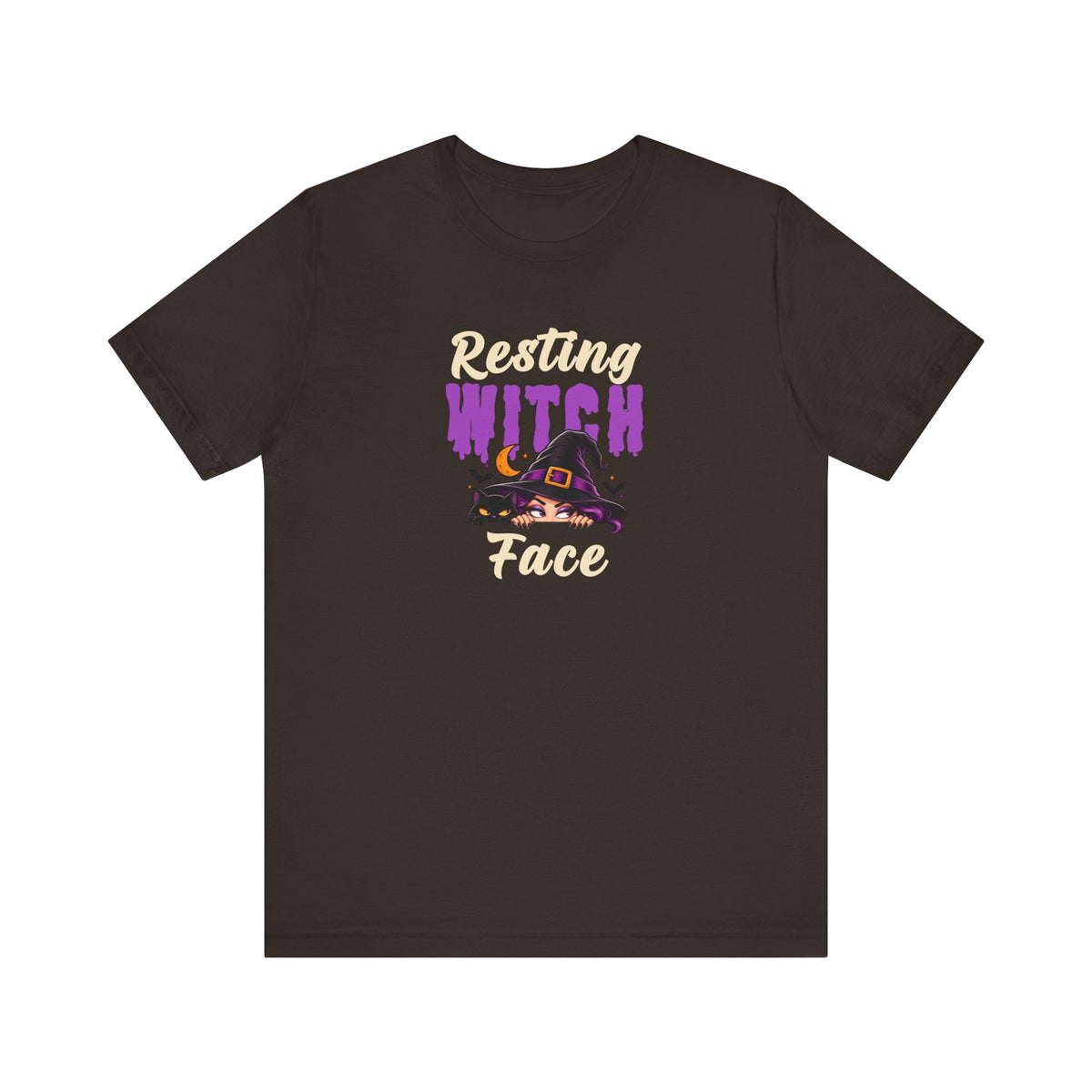 A brown t-shirt with a graphic on the chest that reads 'Resting WITCH Face' in beige and purple lettering, featuring a witch hat illustration.
