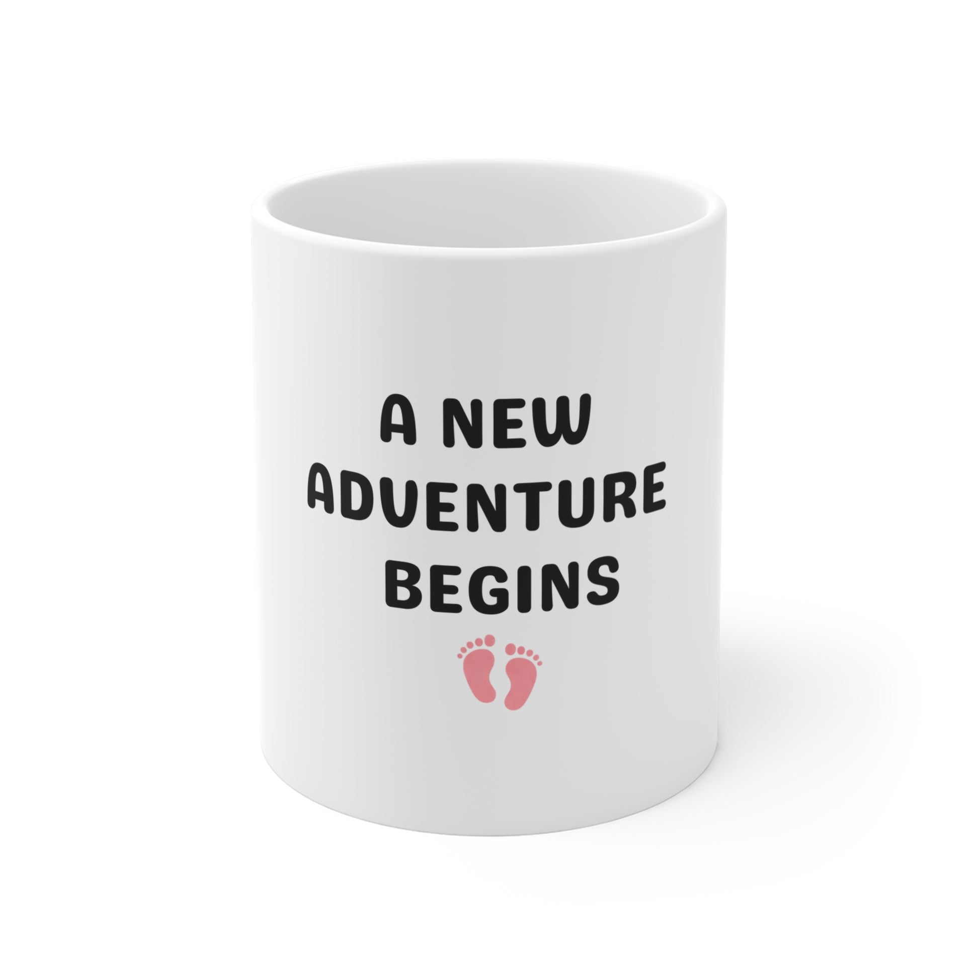 White mug with 'A New Adventure Begins' text and footprints on a white background