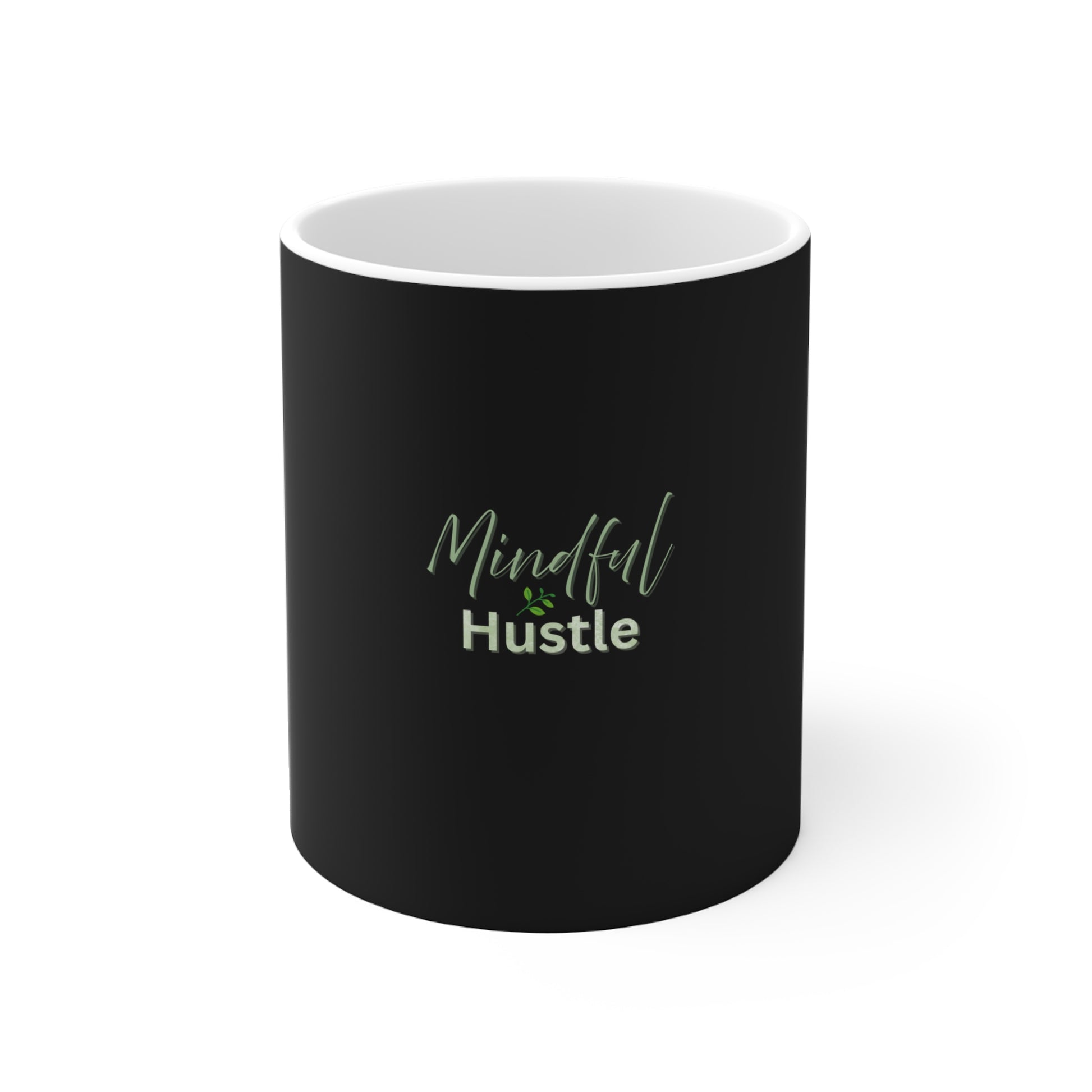 Black mug with 'Mindful Hustle' text on a white background