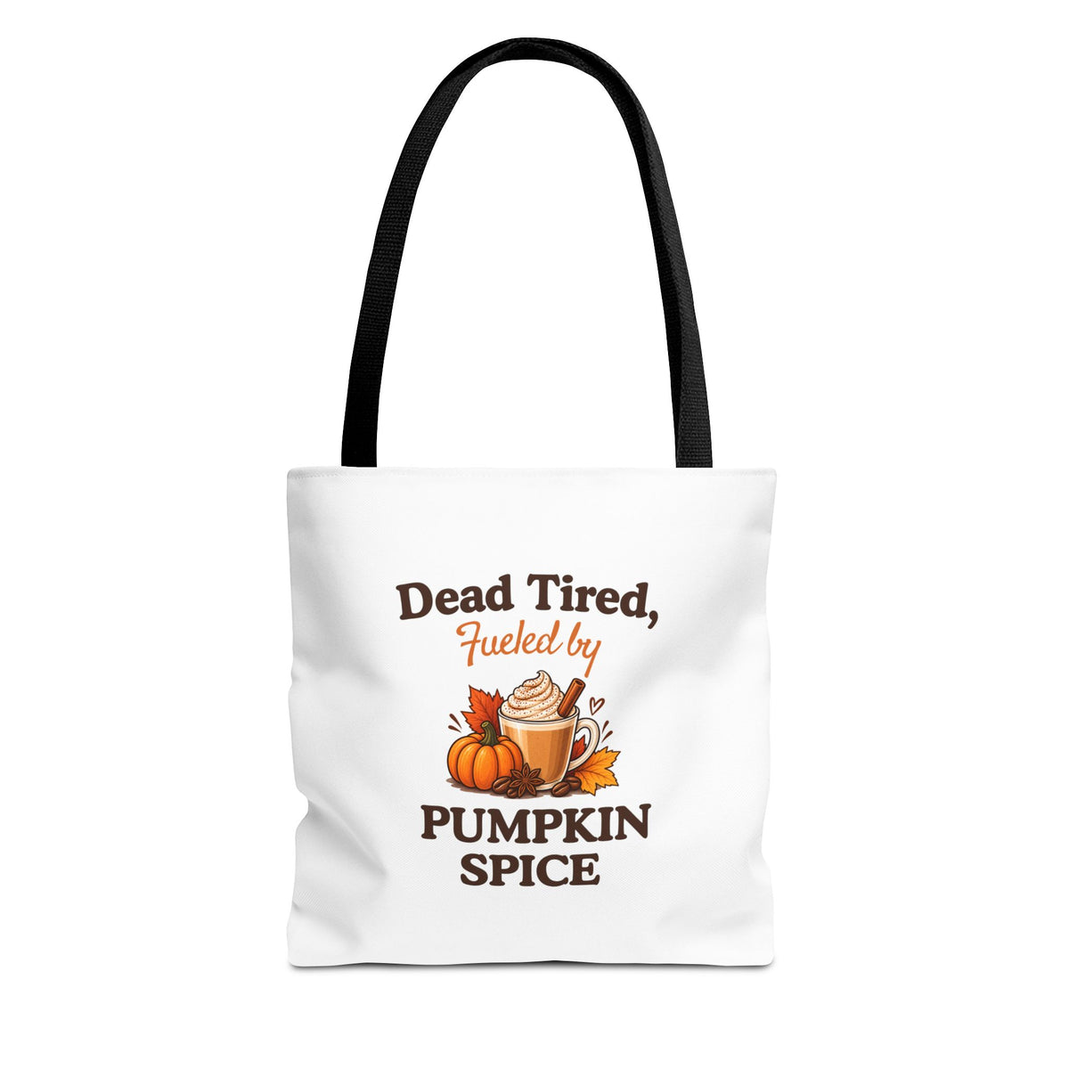 A white canvas tote bag with black shoulder straps, featuring a printed autumn-themed graphic that reads 'Dead Tired, Fueled by Pumpkin Spice'