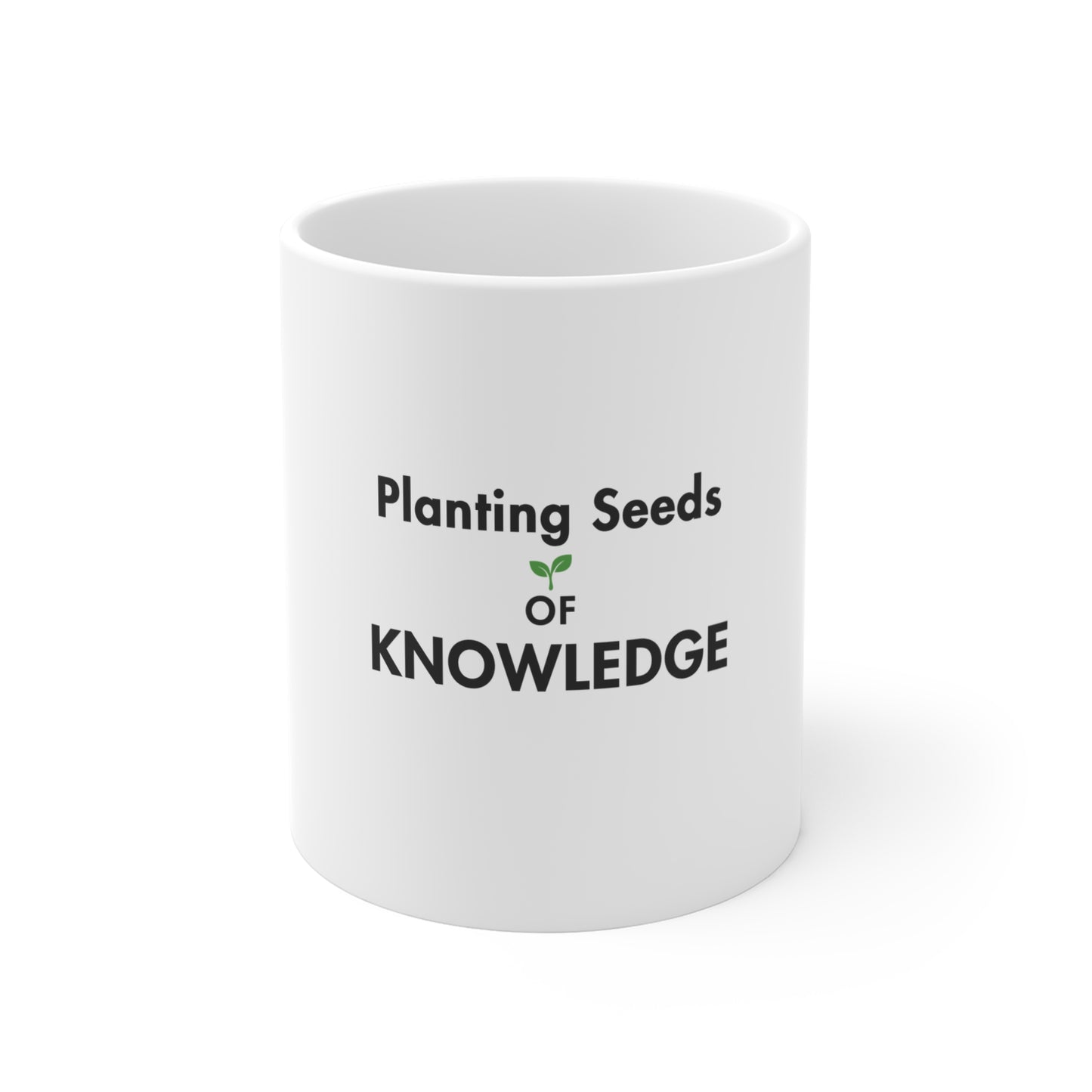White mug with text 'Planting Seeds of Knowledge' on a white background