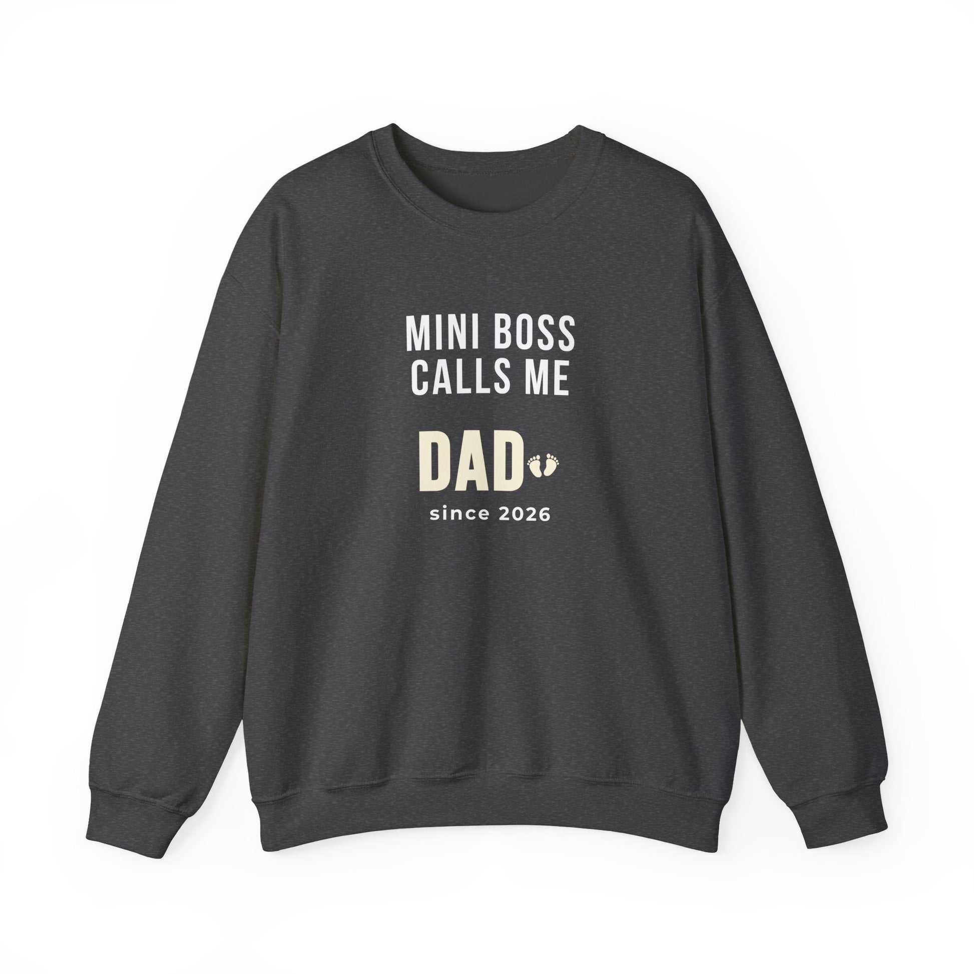 Dark gray sweatshirt with text 'Mini Boss Calls Me Dad – since 2026' on a white background