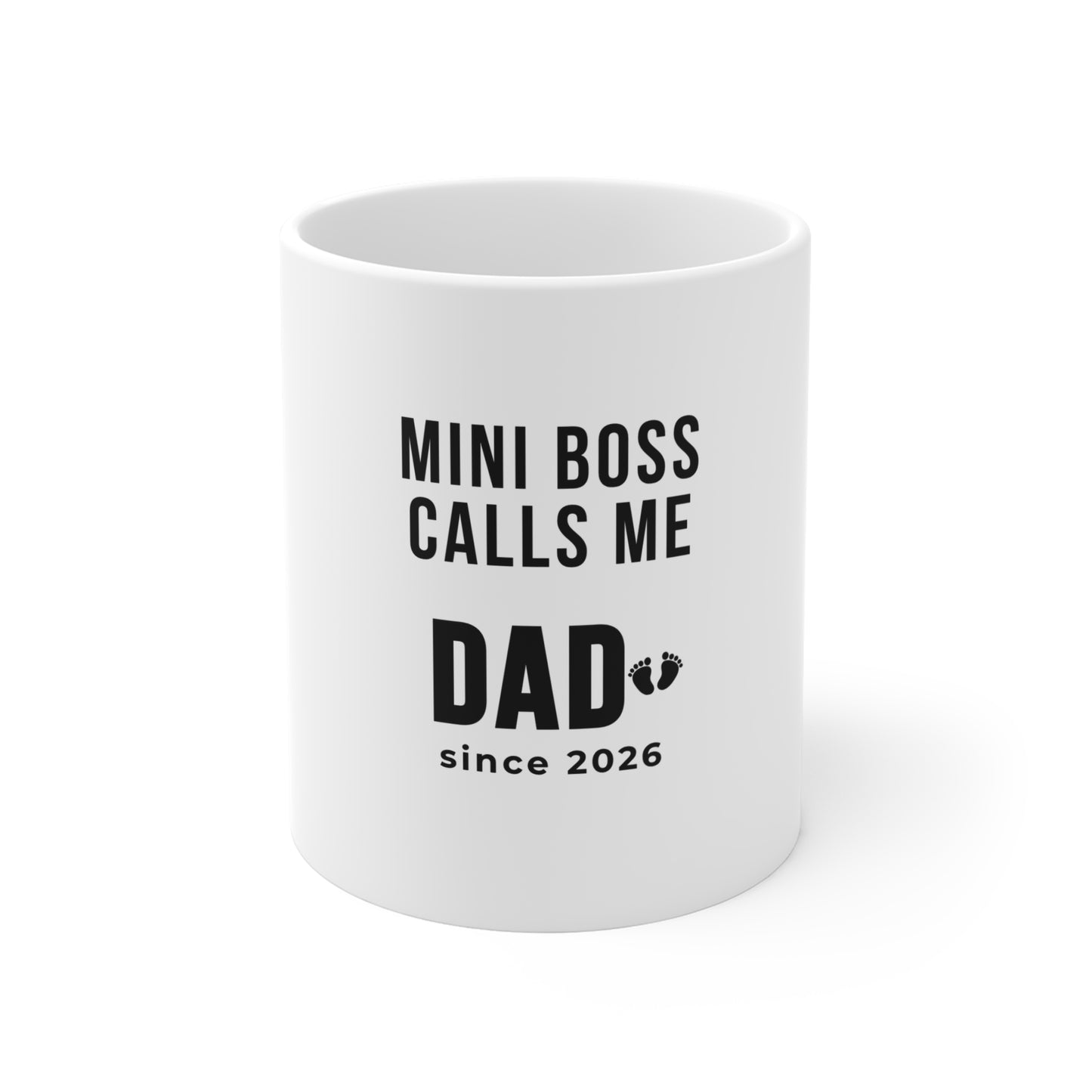 White mug with text 'MINI BOSS CALLS ME DAD since 2026' on a white background