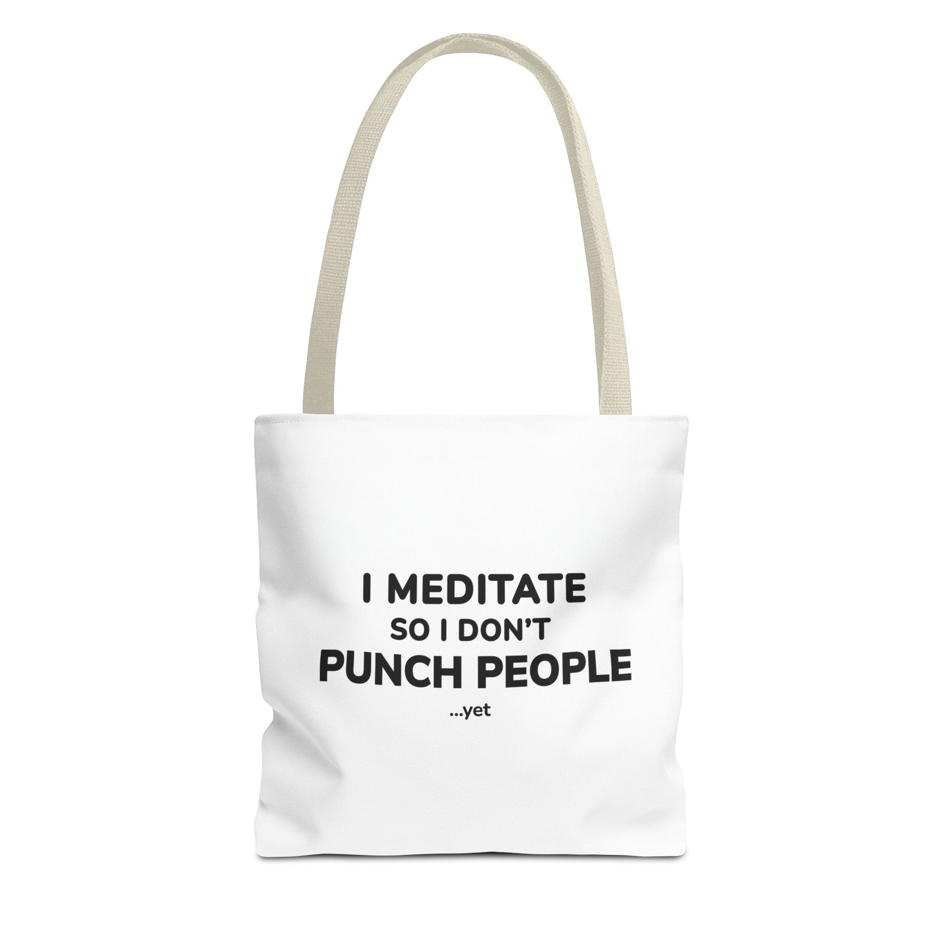 White tote bag with beige handles and text 'I Meditate So I Don’t Punch People...yet' on a white background