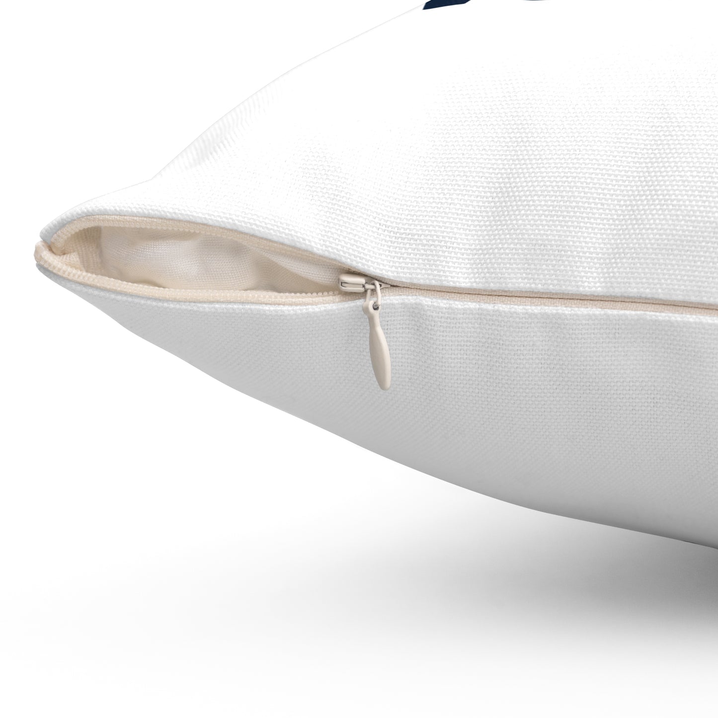 Close-up of a white pillow with a zipper on a white background