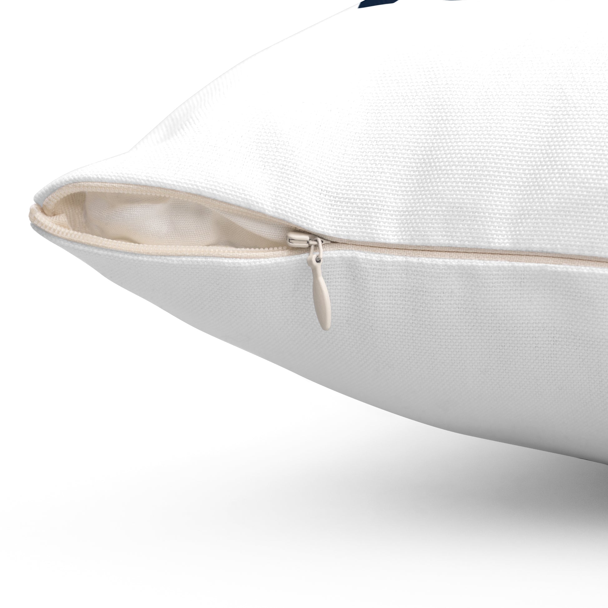 Close-up of a white pillow with a zipper on a white background