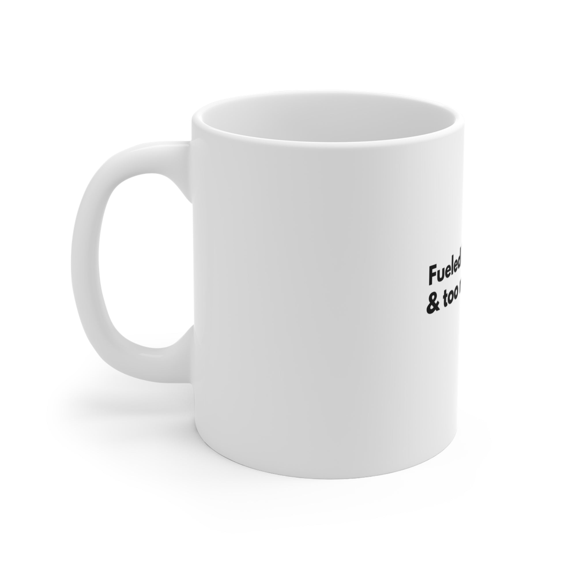 Left side of white mug with black text 'Fueled by hot cocoa & too many emails' on a white background