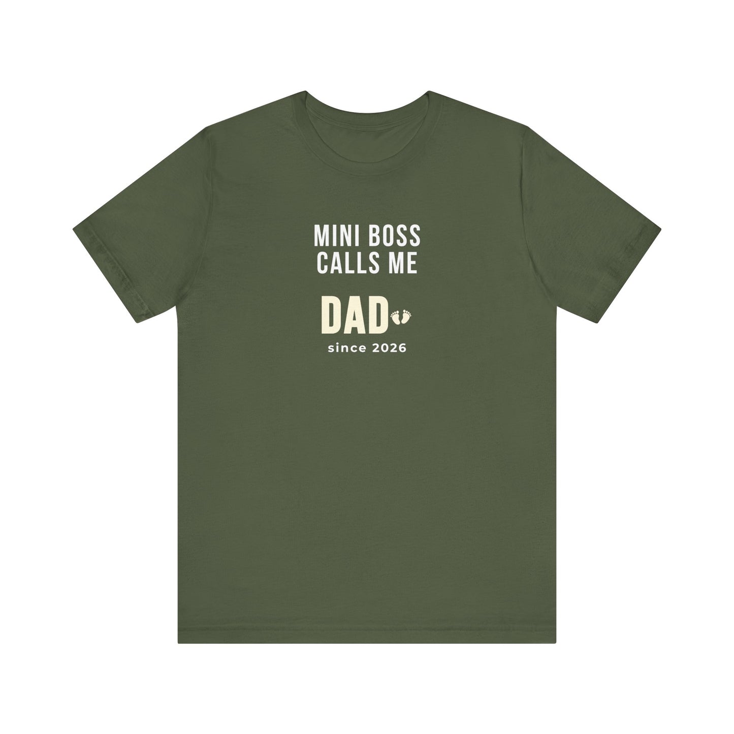 Military green t-shirt with white text 'Mini Boss Calls Me Dad – since 2026' on a white background