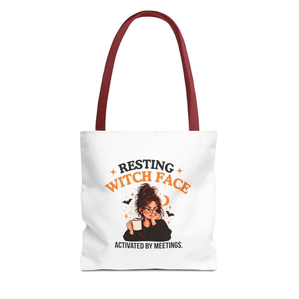 A white canvas tote bag with red shoulder straps, featuring a cartoon witch graphic and the text 'Resting Witch Face. Activated by Meetings.' on a plain white background.
