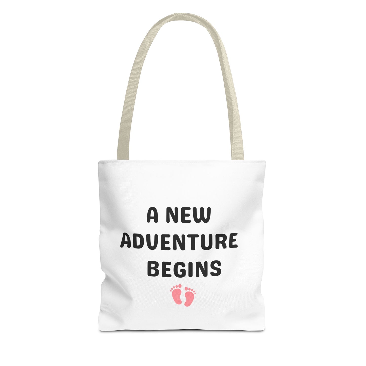 Tote bag with beige handle and text 'A New Adventure Begins' and footprints on a white background