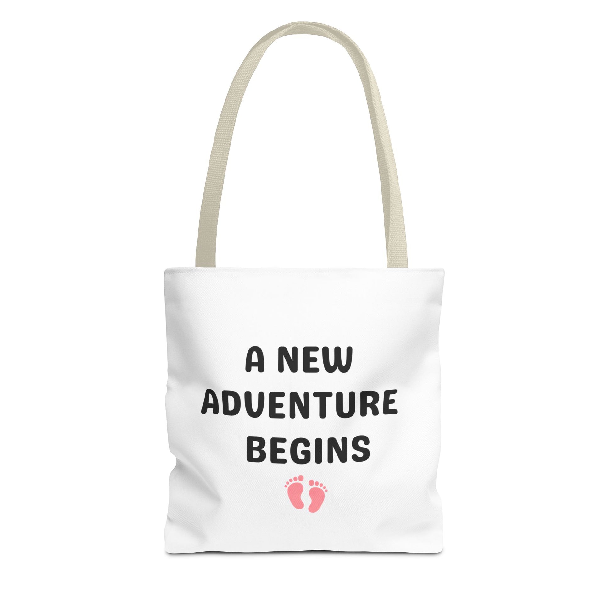Tote bag with beige handle and text 'A New Adventure Begins' and footprints on a white background
