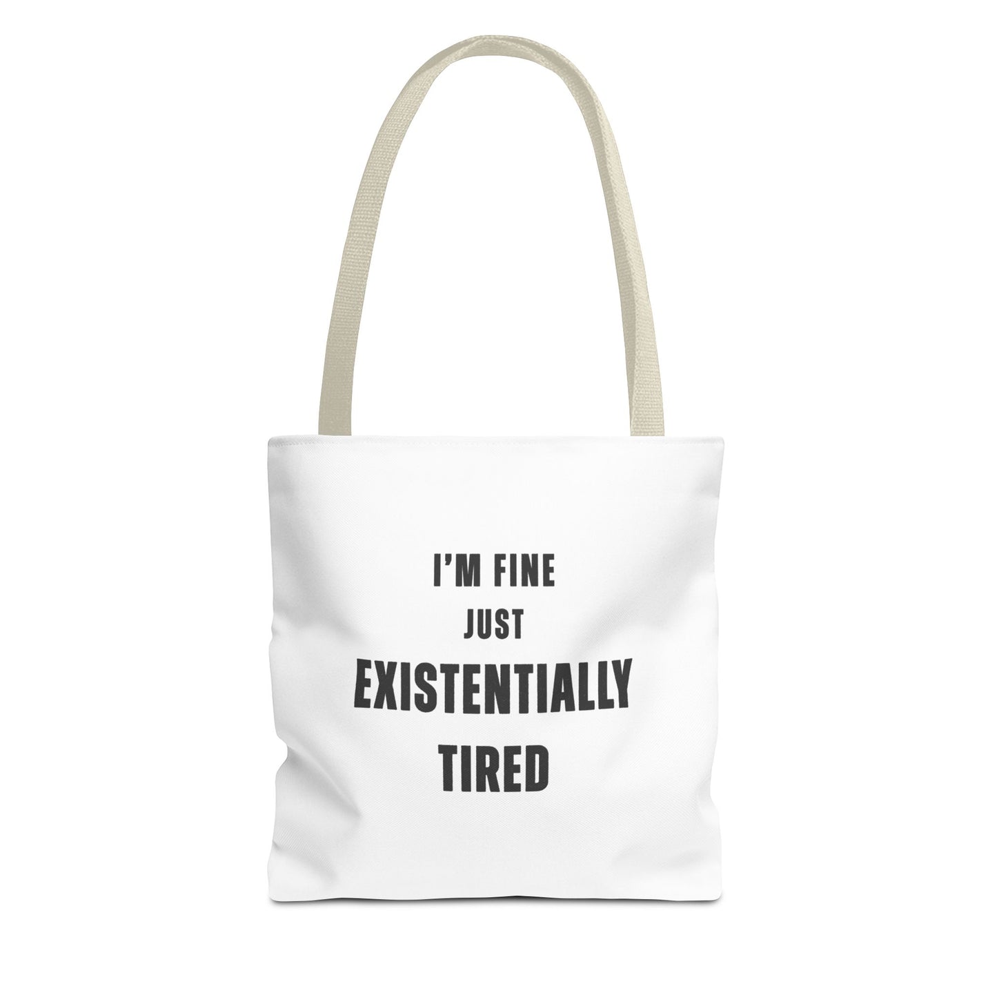 White tote bag with beige handles and text 'I’m fine. Just existentially tired.' on a white background