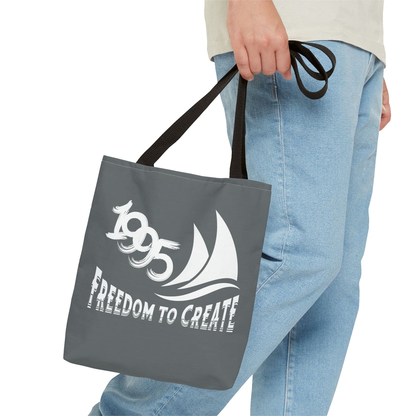 Freedom to Create Tote Bag - with a man holding a grey tote bag with a black strap