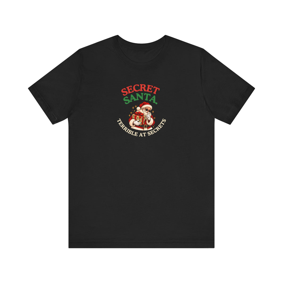 Black t-shirt featuring the “Secret Santa. Terrible at Secrets.” design on a white background
