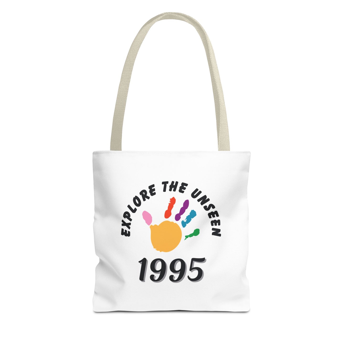 White tote bag with beige handle and text 'Explore the Unseen, 1995' on a white background