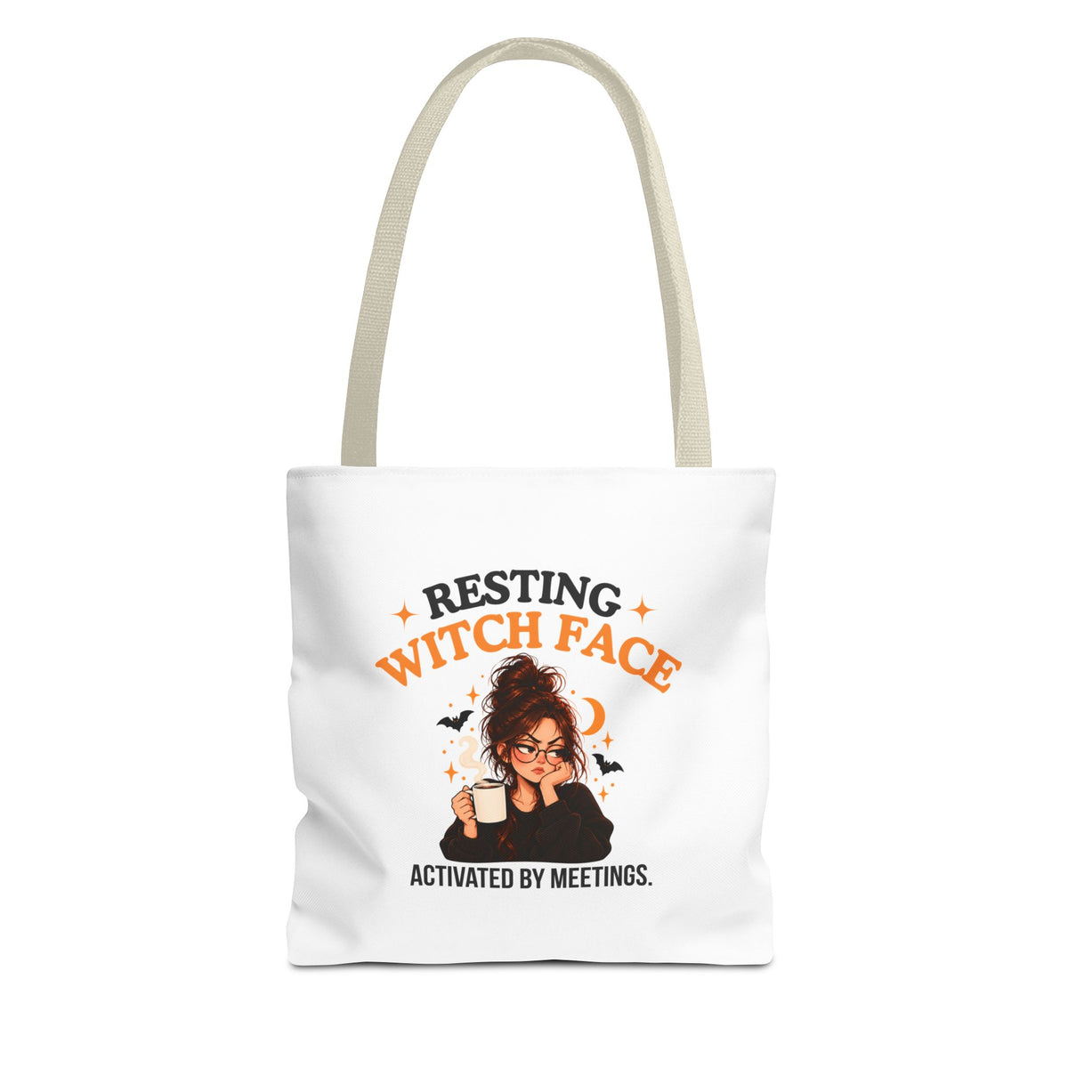 A white canvas tote bag with beige shoulder straps, featuring a cartoon witch graphic and the text 'Resting Witch Face. Activated by Meetings.' on a plain white background.