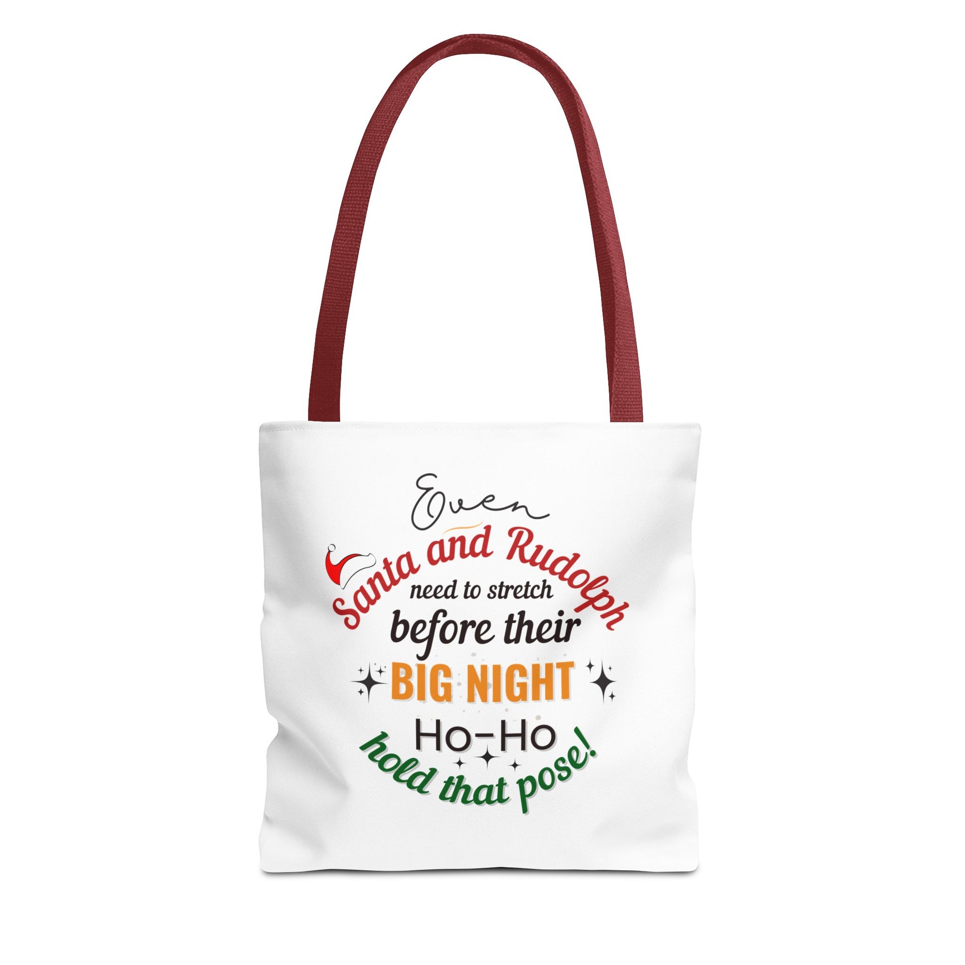 White tote bag with red handle and text 'Event Santa & Rudolph Need to Stretch Before their Big Night. Ho-Ho-Hold That Pose!' on a white background