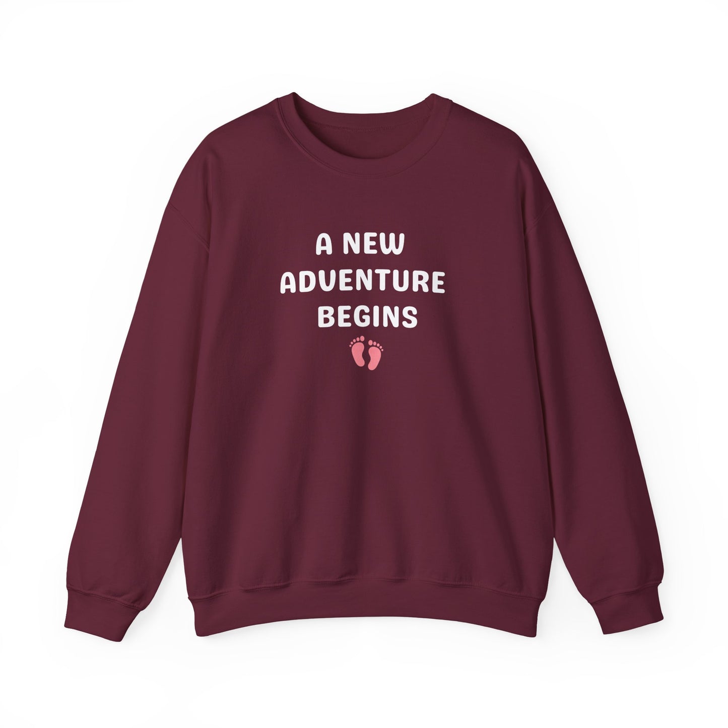 Maroon sweatshirt with 'A New Adventure Begins' text and footprints on a white background