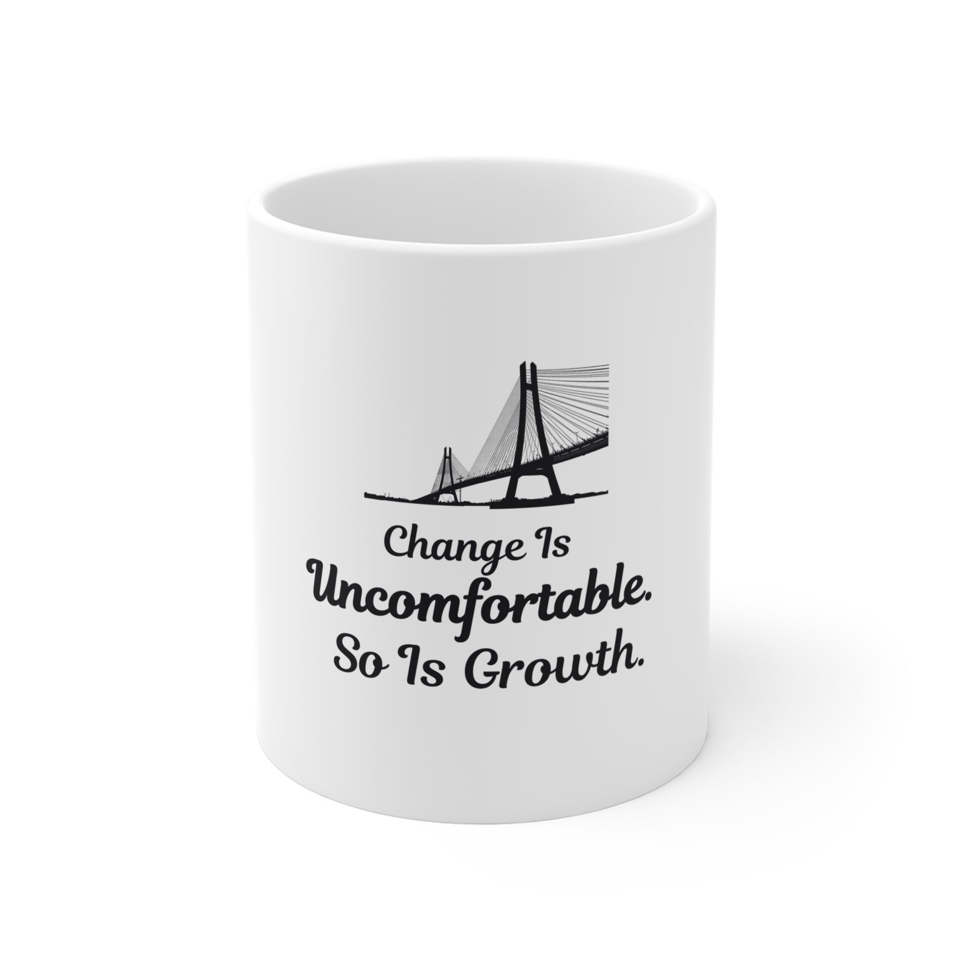 White mug with a bridge design and text 'Change Is Uncomfortable. So Is Growth' on a white background