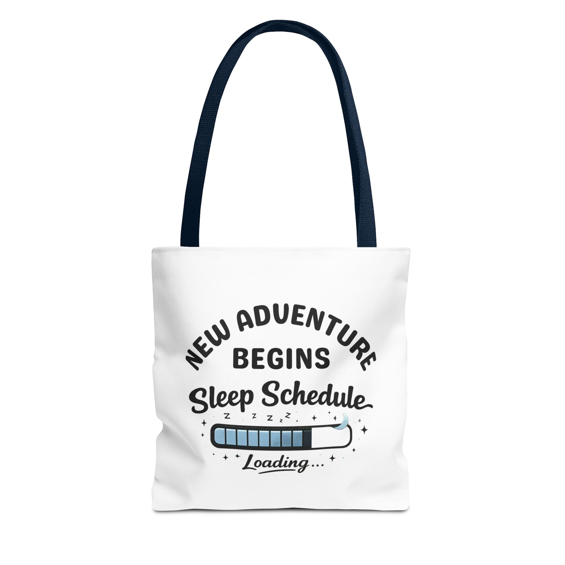 Tote bag with navy handle and 'New Adventure Begins Sleep Schedule Loading' text on a white background