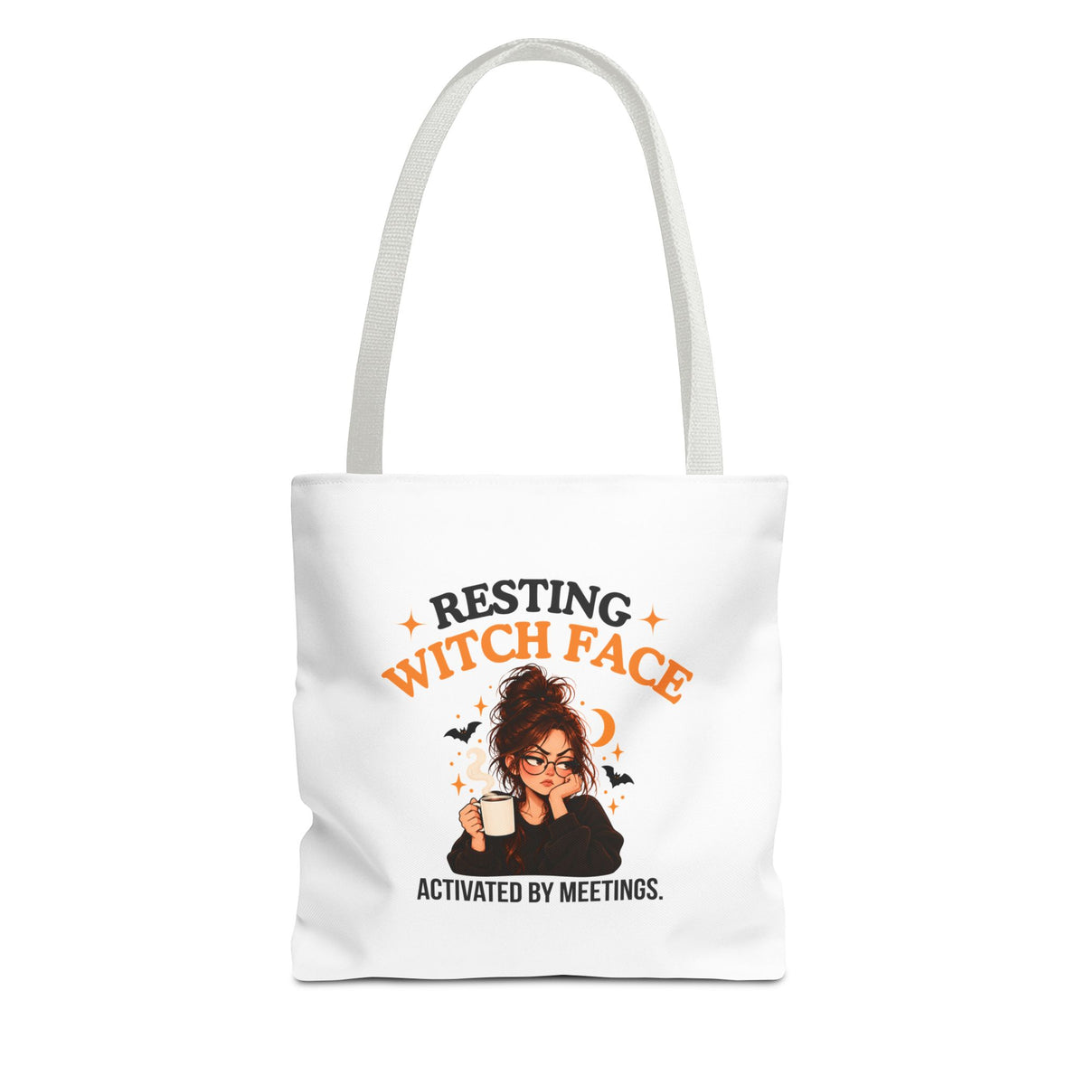 A white canvas tote bag with white shoulder straps, featuring a cartoon witch graphic and the text 'Resting Witch Face. Activated by Meetings.' on a plain white background.
