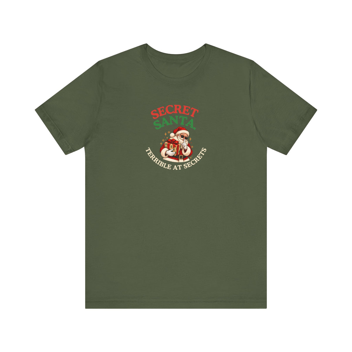 Military green t-shirt featuring the “Secret Santa. Terrible at Secrets.” design on a white background