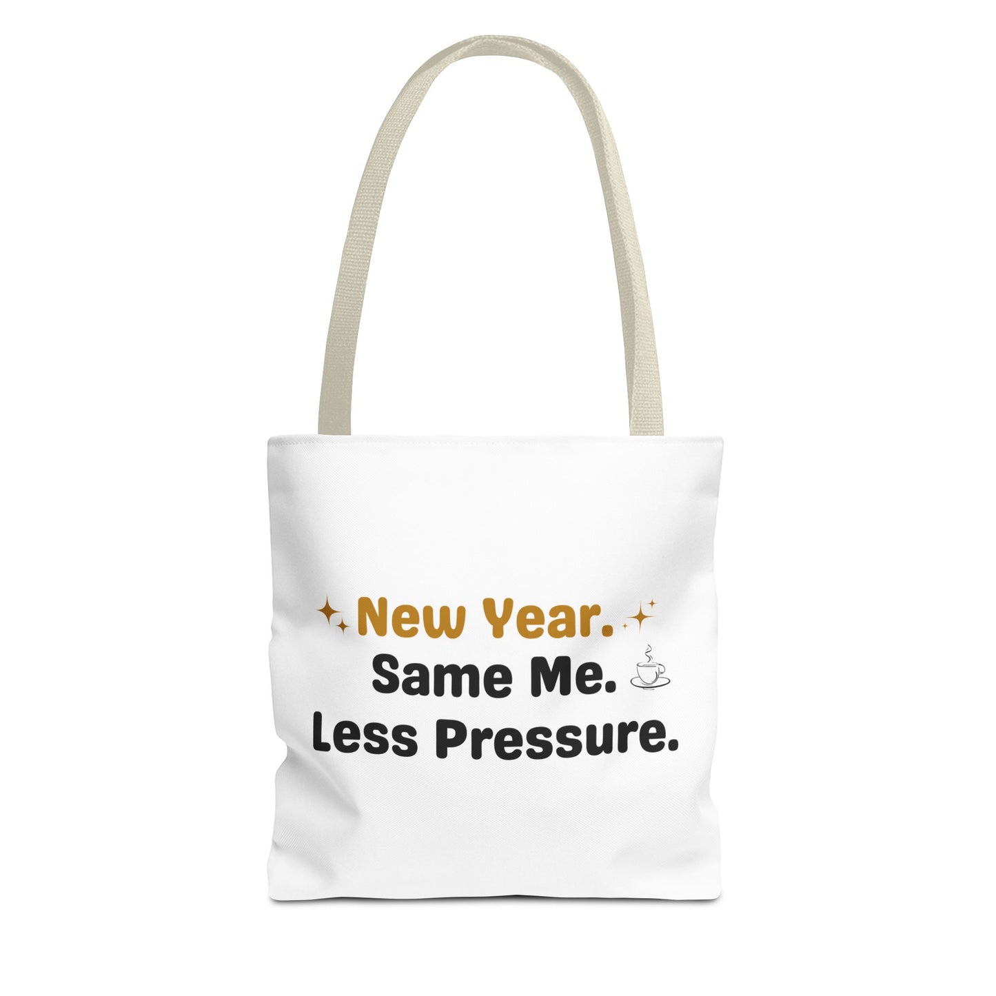 White tote bag with beige handle and text 'New Year. Same Me. Less Pressure.' and handle on a white background