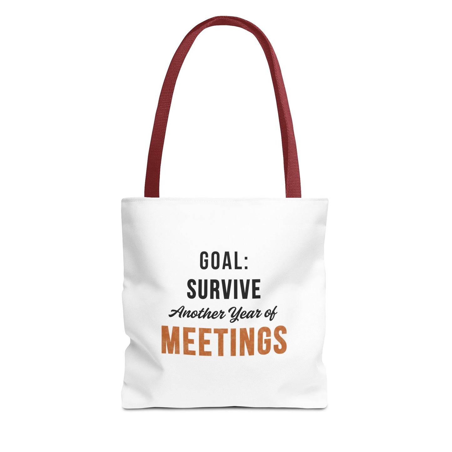 Tote bag with red handles and text 'Goal: Survive Another Year of Meetings' on a white background
