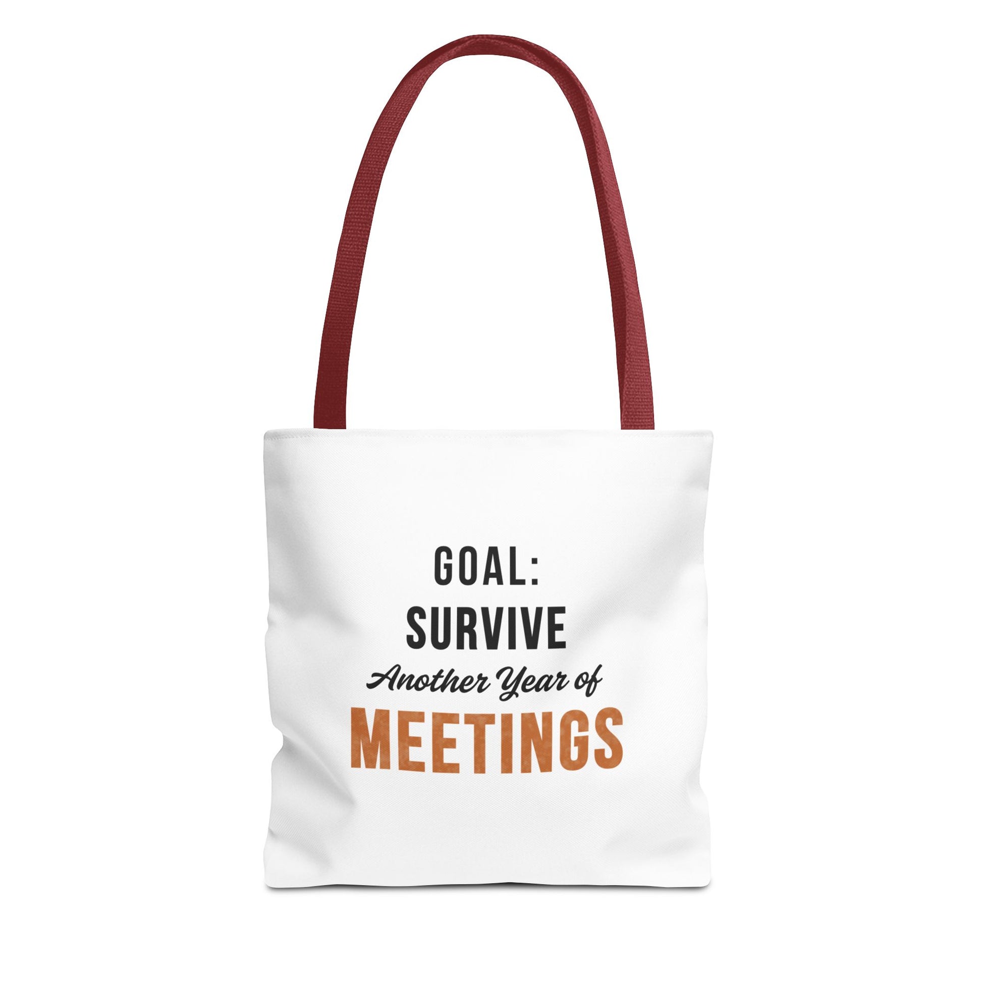 Tote bag with red handles and text 'Goal: Survive Another Year of Meetings' on a white background
