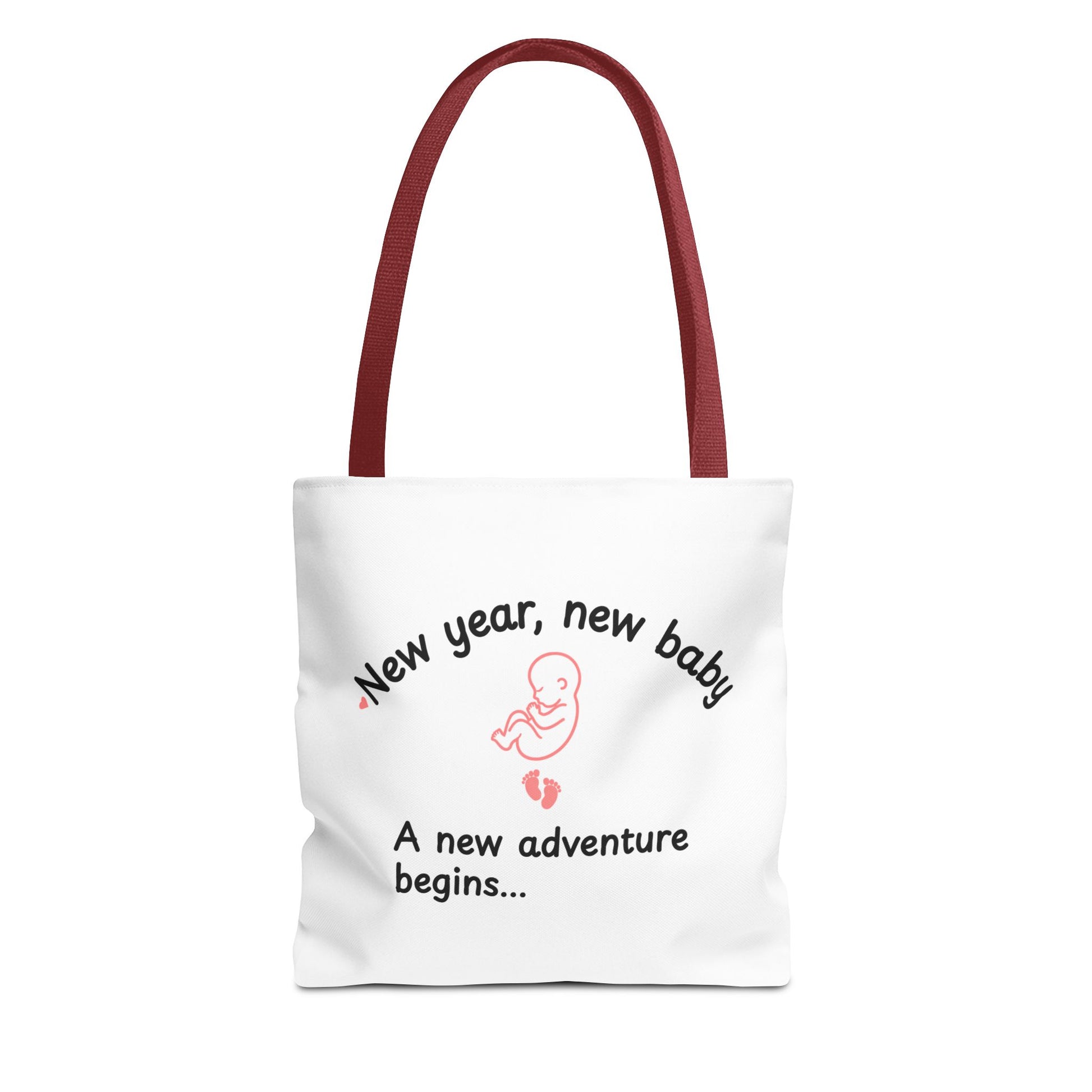 A white tote bag with red handle featuring the text 'New year, new baby. A new adventure begins...' on white background