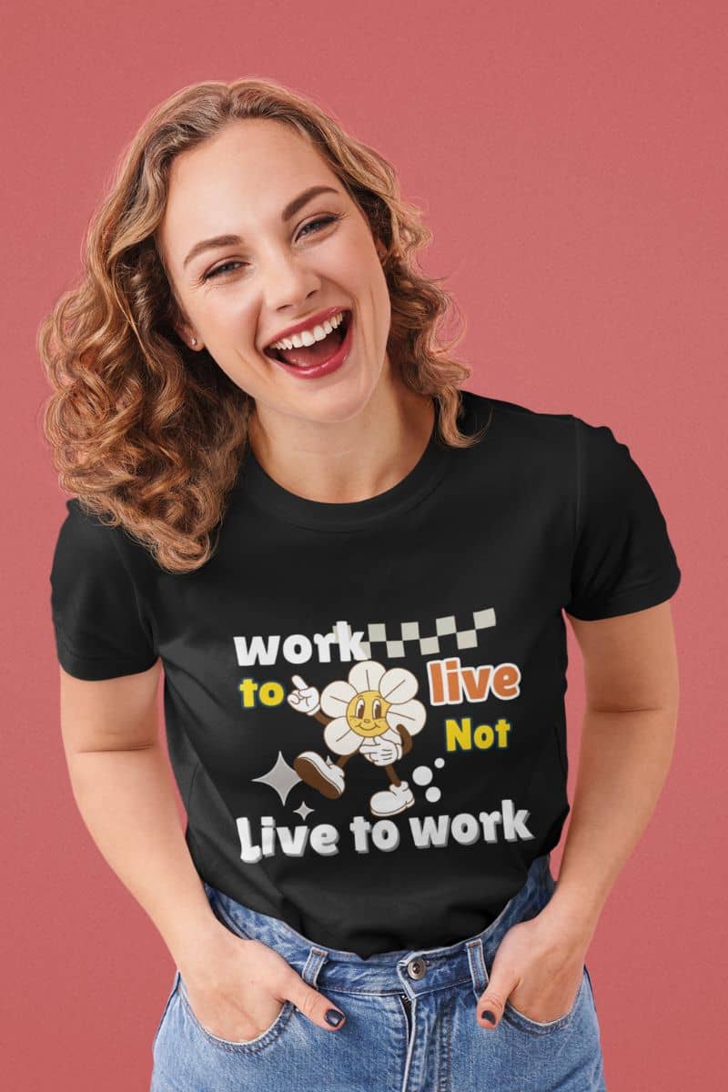 Balanced life quote T-Shirt with a woman wearing a black t-shirt with the quote 'Work to Live, Not Live to Work' on a pink background