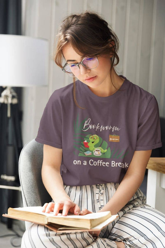 Bookworm coffee break t-shirt with a girl sitting on a chair reading a book