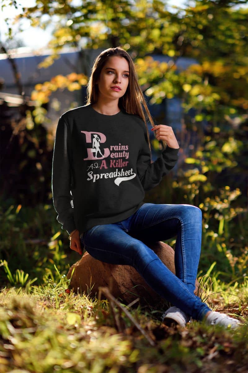 Boss babe sweatshirt with a young girl sitting and posing on a rock