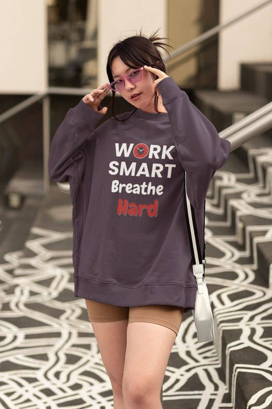 Burnout recovery sweatshirt  for professionals with a person wearing a sweatshirt with motivational text on a patterned floor.
