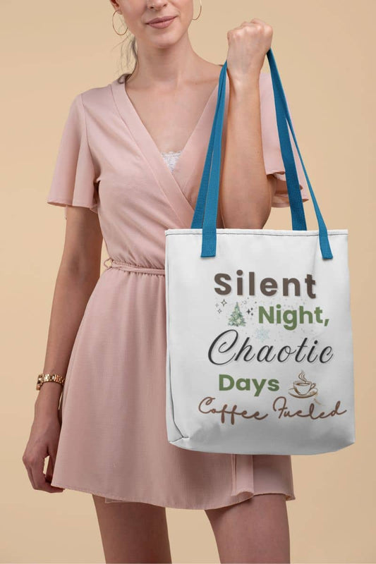 Christmas tote bag with a woman holding a tote bag with text 'Silent Night, Chaotic Days, Coffee Fueled' on a beige background