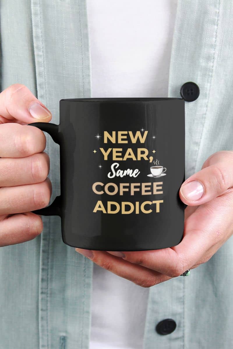 Coffee addict mug with a person holding a mug with text 'New Year, Same Coffee Addict'
