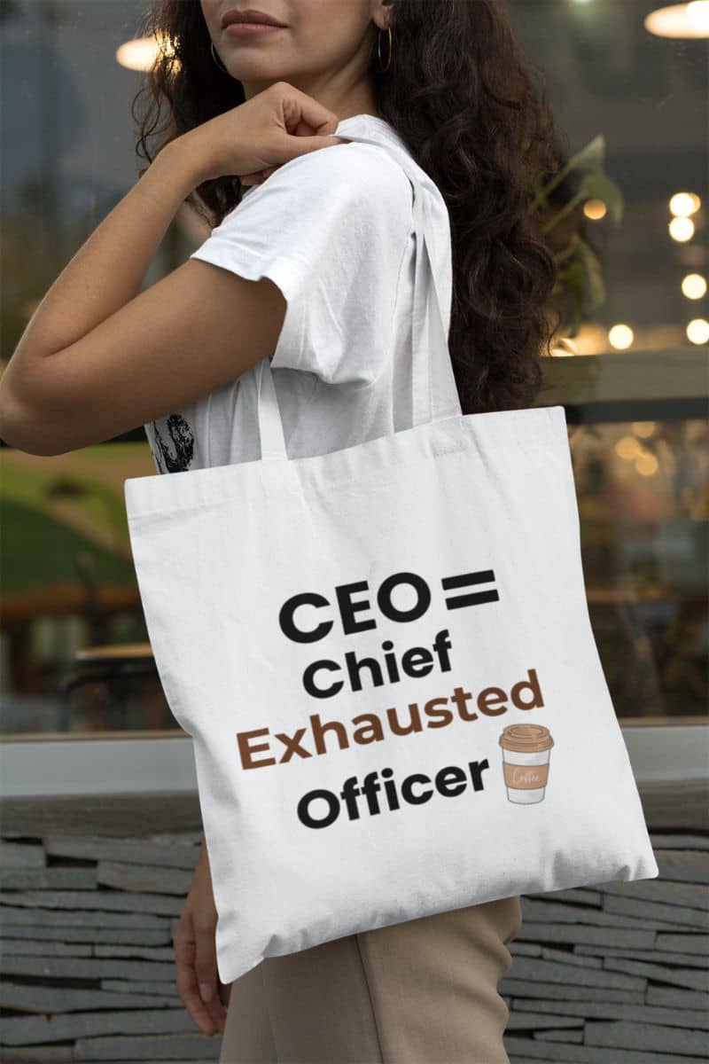 Coffee lover tote bag with a person holding a tote bag with 'CEO = Chief Exhausted Officer' text and a coffee cup icon.