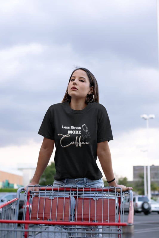 Coffee lover t-shirt with a girl standing on a shopping cart in the parking lot of a supermarket