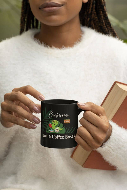 Coffee mug for readers with a black woman holding a book and a coffee cup in her hand