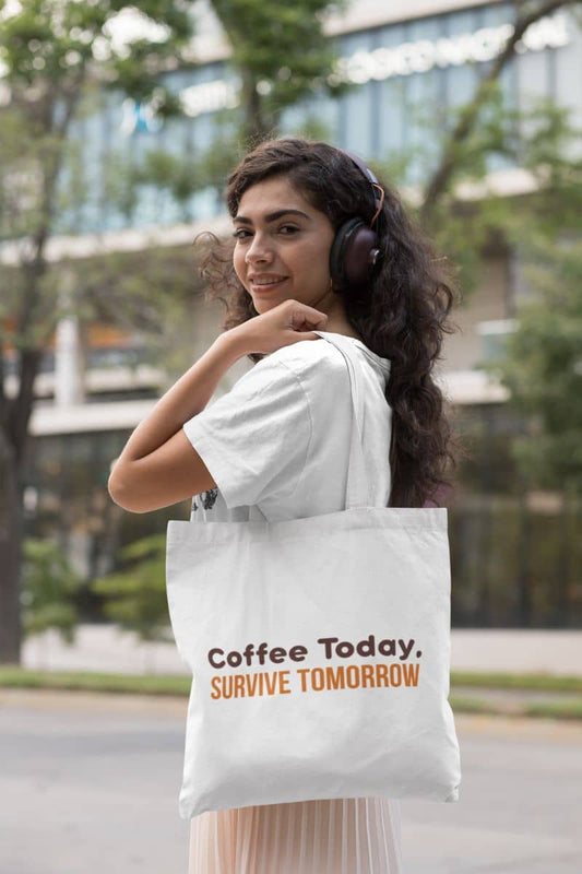 Coffee quote tote bag with a woman holding a tote bag with text 'Coffee Today, Survive Tomorrow'