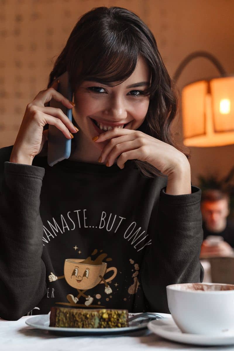 Comfy yoga and coffee sweatshirt with a girl taking on the phone in a coffee shop